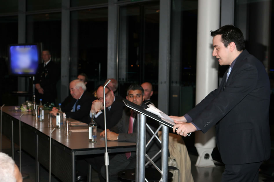 Neil speaking on top floor of City Hall, London with guests seated